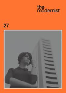cover of the modernist magazine, black and white photo of woman in front of a high-rise building